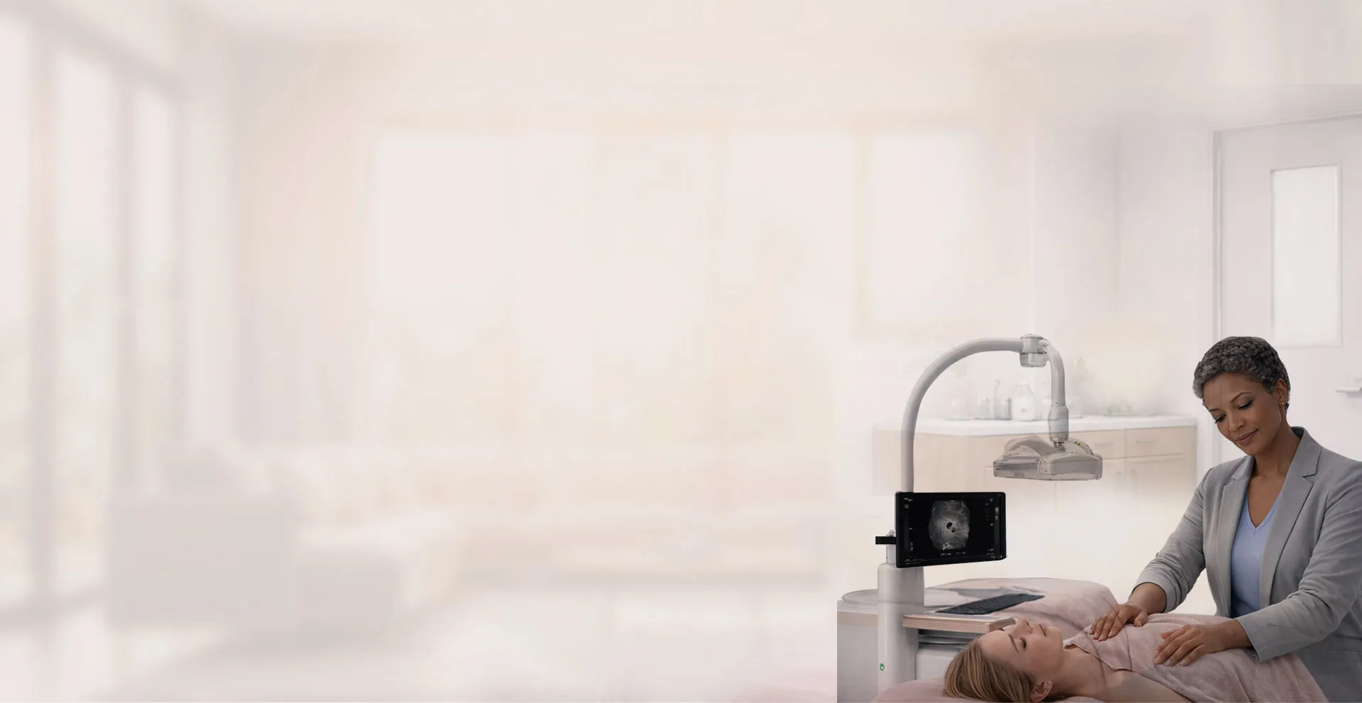 Radiologist performing ABUS breast screening at Genesis while answering common patient questions
